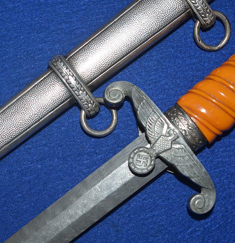GERMAN ARMY OFFICERS DAGGER WITH DAMASCUSE BLADE.