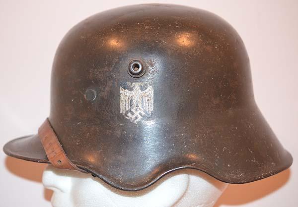 VERY RARE GERMAN M18 MODEL HELMET WITH EAR CUT OUTS, RE-ISSUED TO THE ARMY DURING THE THIRD REICH.