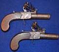 A PAIR OF FLINTLOCK POCKET PISTOLS BY SMITH OF LONDON.