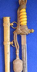THIRD REICH NAVAL OFFICERS DAGGER BY WKC WITH DARK YELLOW GRIP, HAMMERED SCABBARD AND GOLD KNOT.