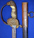 THIRD REICH NAVAL OFFICERS SWORD BY WKC WITH SCARCE ENGRAVED BLADE.
