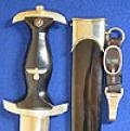 SS DAGGER 1933 MODEL BY KLASS STAMPED WITH OWNERS SS MEMBERSHIP NUMBER AND COMPLETE WITH HANGER.