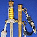 NAVAL DAGGER 1938 MODEL WITH ORANGE GRIP BY WKC COMPLETE WITH SILVER STRAP AND KNOT.