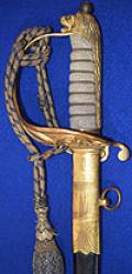 WW1 BRITISH NAVAL OFFICERS SWORD COMPLETE WITH DRESS KNOT.