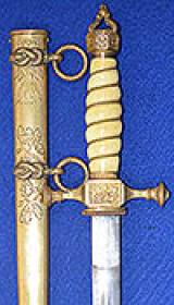 GERMAN IMPERIAL NAVAL OFFICERS DAGGER WITH DAMASCUSE BLADE AND DELUX SCABBARD.