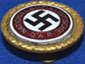 LARGE 30MM SIZE NSDAP GOLD PARTY BADGE, VERY RARE TYPE WITH LAPEL FITTING TO THE REVERSE SIDE.