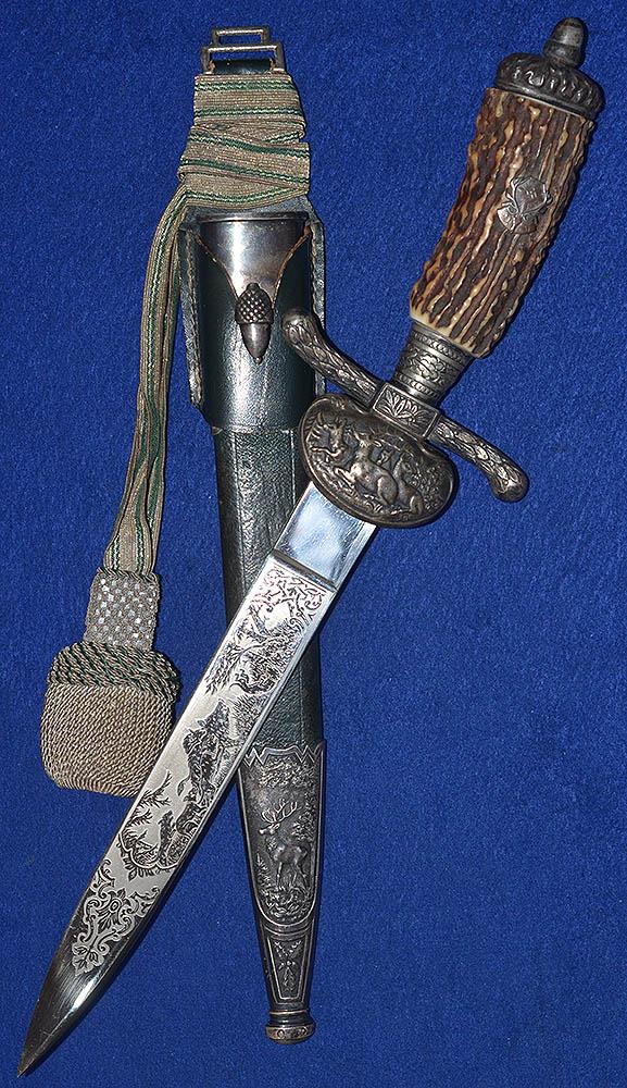 VERY RARE & EXTRA DELUXE SHORT MODEL HUNTING DAGGER BY ALCOSO COMPLETE WITH HANGER AND KNOT.