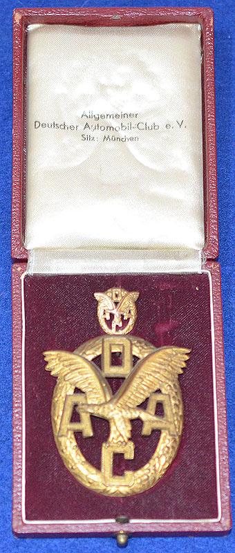 THIRD REICH CASED GOLD ADAC AUTOMOBILE ORGANIZATION BADGE AND MINIATURE.