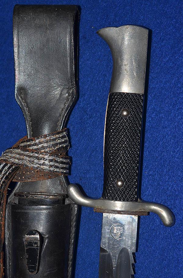 THIRD REICH LONG MODEL FIRE SERVICE BAYONET WITH SAW BACK BLADE WITH SWASTIKA IN THE TRADE MARK .
