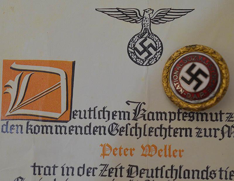 NSDAP LARGE SIZE GOLD PARTY BADGE WITH ORIGINAL DOCUMENT AWARDED TO PETER WELLER.