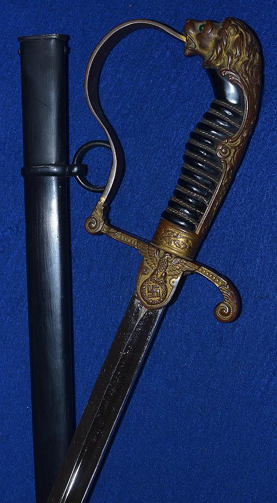 ARMY OFFICERS SWORD BY WKC WITH VERY EARLY STYLE EAGLE AND UNUSUAL GREEN EYES.