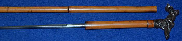 VICTORIAN SWORD STICK WITH BRONZE HANDLE DEPICTING A YOUNG GIRL.