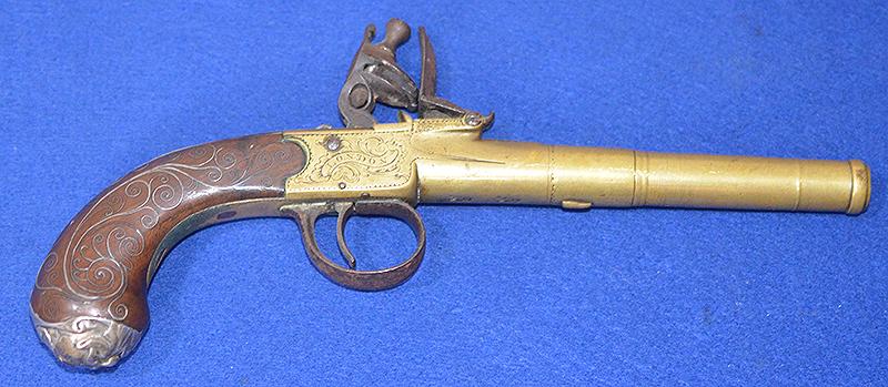 FLINT LOCK PISTOL WITH BRASS CANNON BARREL BY WITTMORE LONDON WITH SILVER INLAY.