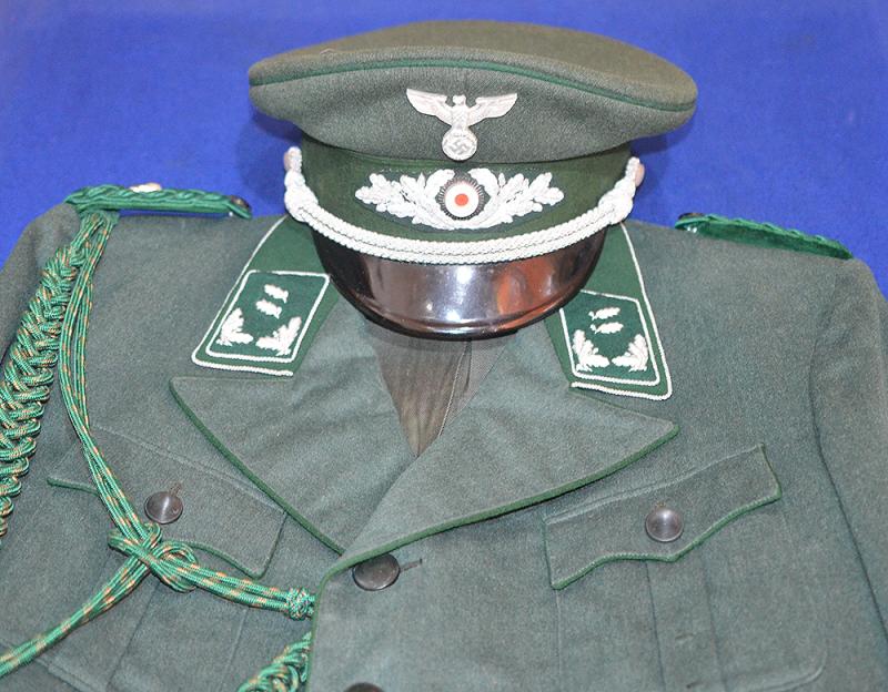 THIRD REICH STATE FORESTRY OFFICERS  UNIFORM WHICH COMPRISES, TUNIC, AIGUILLETTE AND BREECHES.