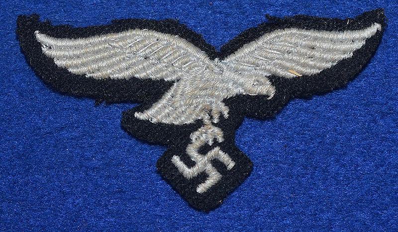 LUFTWAFFE OTHER RANKS CAP EAGLE ON BLACK BACKING.