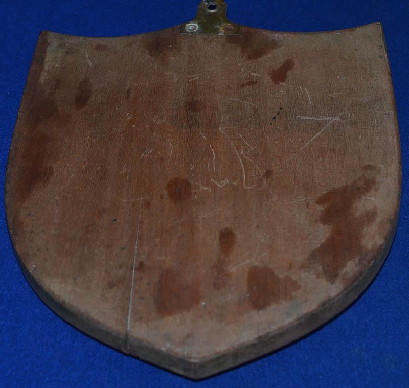 LARGE HITLER PLAQUE MOUNTED ON WOODEN SHIELD.