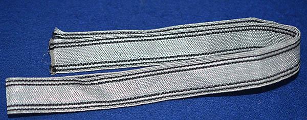 CLOTH STRAP FOR AN SS OFFICERS SWORD KNOT.