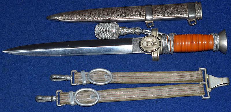 RED CROSS OFFICERS DAGGER COMPLETE WITH STRAPS AND KNOT.