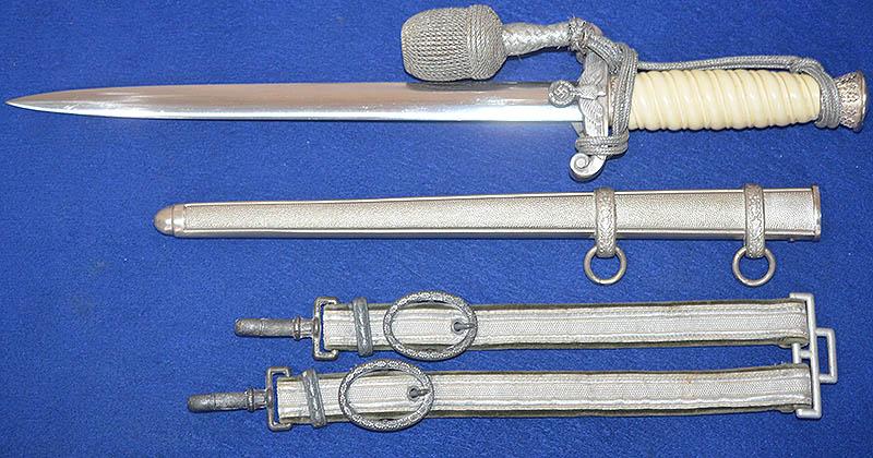 ARMY OFFICERS DAGGER BY WKC WITH HANGERS AND KNOT.