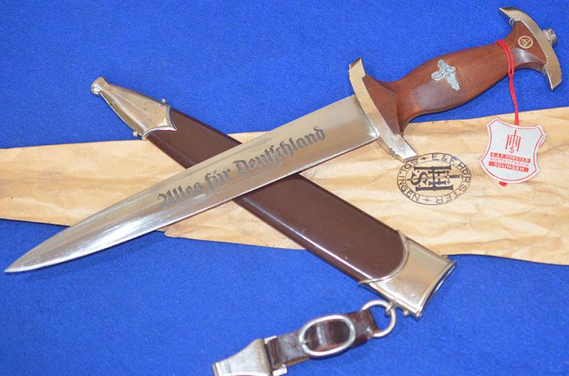 MINT UNISSUED SA DAGGER BY HORSTER COMPLETE WITH ISSUE TAG, BAG AND LEATHER HANGER.