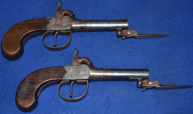 PAIR OF ANTIQUE PERCUSSION POCKET PISTOLS WITH FITTED SPRING BAYONETS BY REED LONDON.