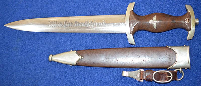 SA ROHM HONOUR DAGGER BY WUSTHOF WITH PARTIAL ROHM INSRIPTION AND COMPLETE WITH HANGER.