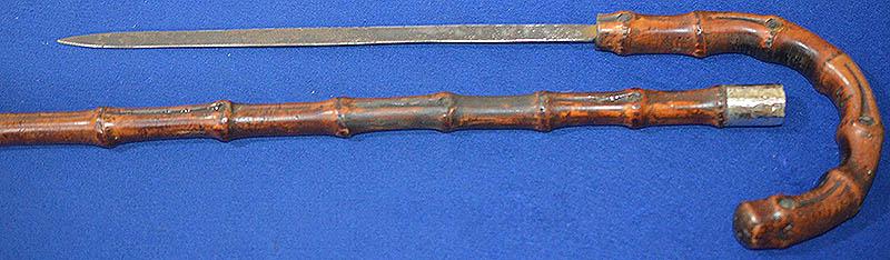 ENGLISH EDWARDIAN SWORD STICK WITH ORNATE SILVER MARKED MOUNT.