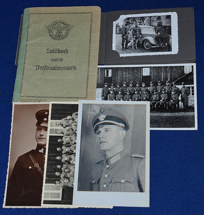 SS POLICE OFFICER SOLDBUCH WITH PHOTOGRAPH ALBUM.