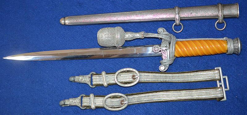 ARMY OFFICERS DAGGER 1935 MODEL BY SMF WITH EARLY STYLE GRIP AND COMPLETE WITH HANGERS AND KNOT.