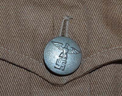 THIRD REICH POLITICAL LEADERS ORTSGRUPPE BROWN SHIRT COMPLETE WITH INSIGNIA.