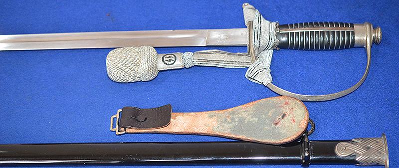 SS OFFICERS SWORD BY KREBS COMPLETE WITH SS KNOT AND BLACK LEATHER HANGER.