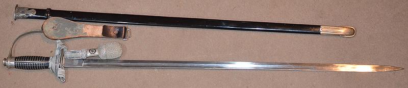 SS OFFICERS SWORD BY KREBS COMPLETE WITH SS KNOT AND BLACK LEATHER HANGER.