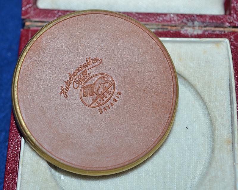 NSDAP 1934 COMEMORATIVE PLAQUETTE FOR THE NURNBERG RALLY COMPETITIONS WITH ORIGINAL PRESENTATION BOX.