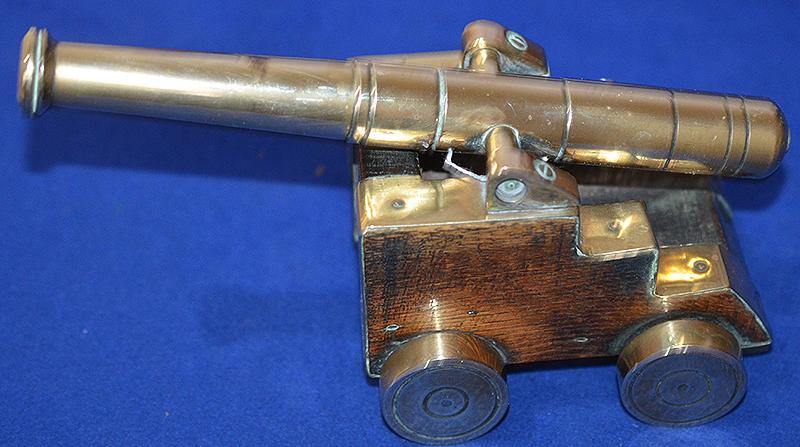 BRITISH ANTIQUE MODEL OF A CANNON.