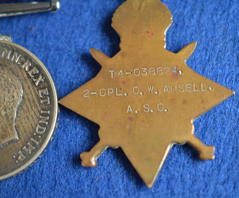SET OF THREE WW1 BRITISH MEDALS COMPLETE WITH THE OWNERS CAP BADGE.