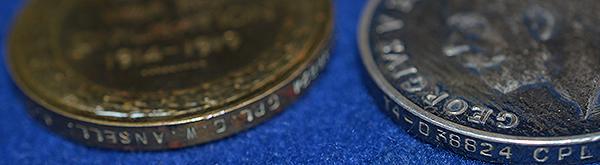 SET OF THREE WW1 BRITISH MEDALS COMPLETE WITH THE OWNERS CAP BADGE.