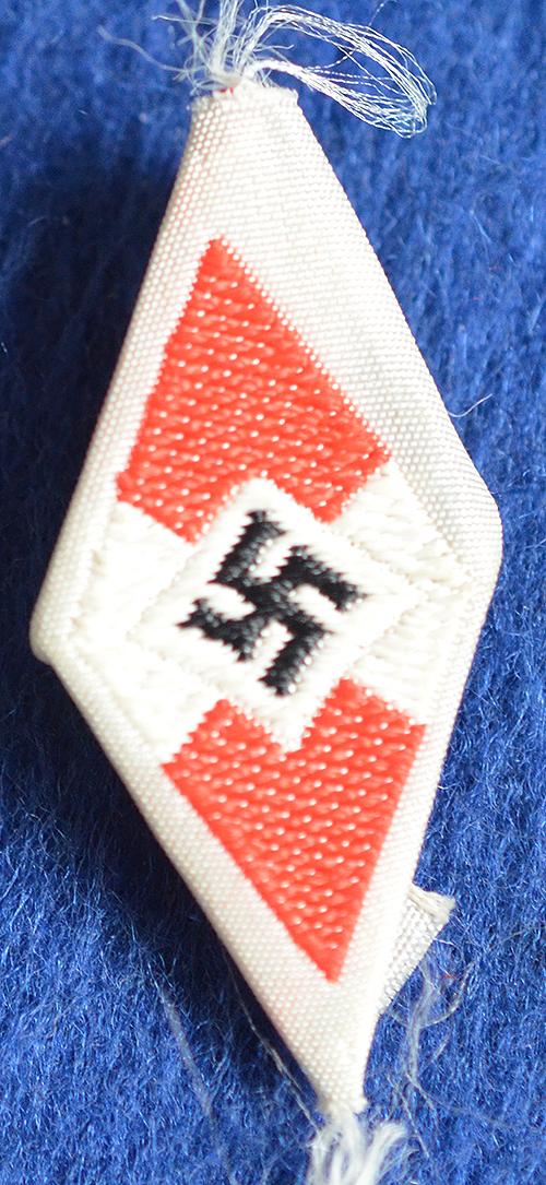 HITLER YOUTH CLOTH CAP BADGE.