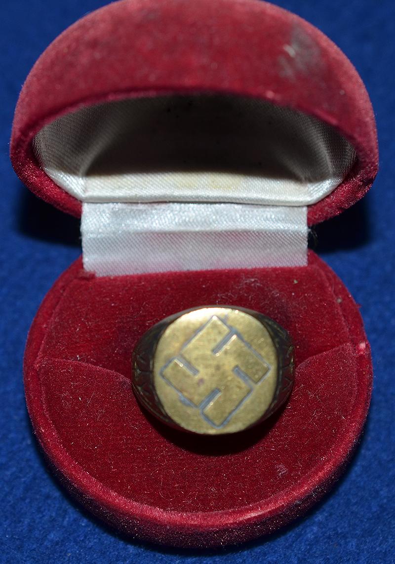SWASTIKA DECORATED FINGER RING.