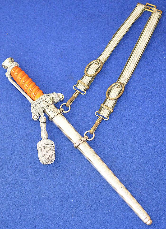GERMAN ARMY OFFICER DAGGER 1935 MODEL BY HOLLER COMPLETE WITH STRAPS AND KNOT.