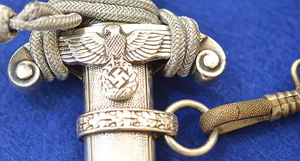 GERMAN ARMY OFFICER DAGGER 1935 MODEL BY HOLLER COMPLETE WITH STRAPS AND KNOT.