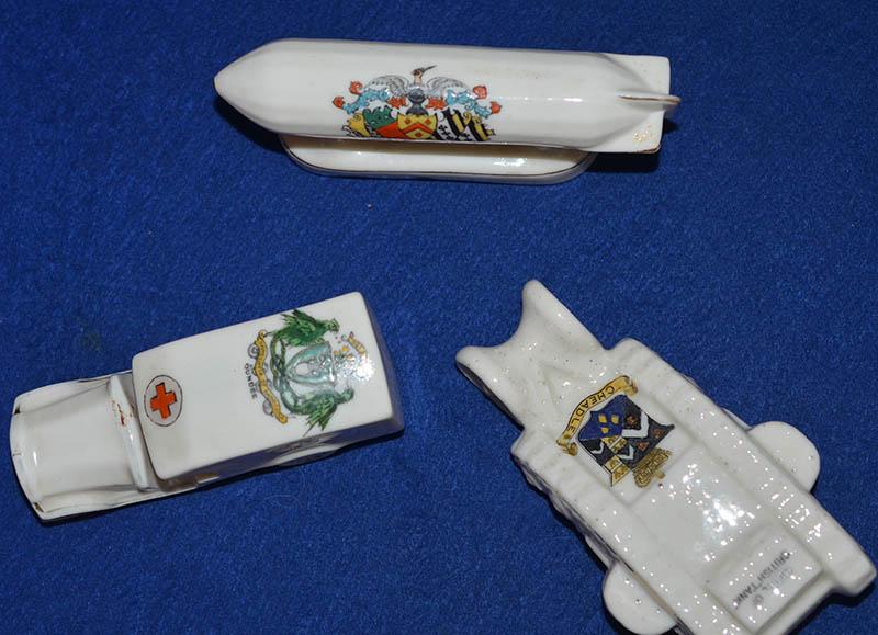 SET OF THREE WW1 CRESTED CHINA MILITARY MODELS.