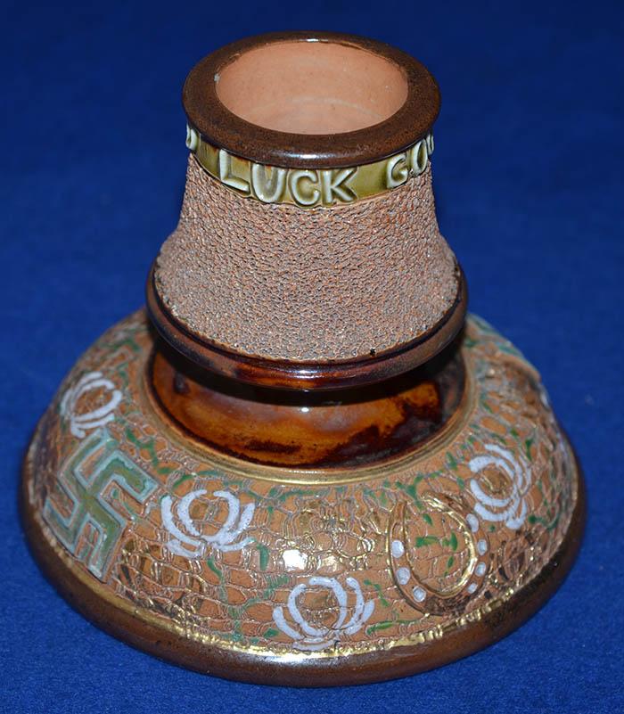 ENGLISH SWASTIKA DECORATED POTTERY MATCH STRIKER BY DOULTON.