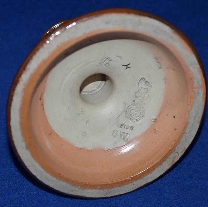 ENGLISH SWASTIKA DECORATED POTTERY MATCH STRIKER BY DOULTON.