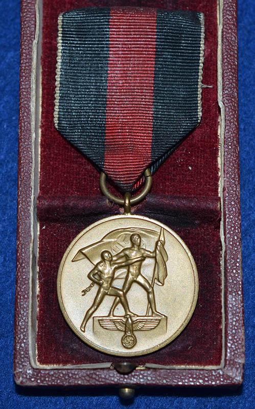 CASED 1ST OF OCTOBER MEDAL.
