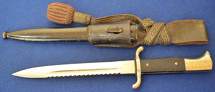 THIRD REICH NCO SHORT MODEL FIRE SERVICE BAYONET WITH MINT SAWBACK BLADE COMPLETE WITH FROG AND KNOT.