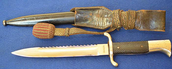 THIRD REICH NCO SHORT MODEL FIRE SERVICE BAYONET WITH MINT SAWBACK BLADE COMPLETE WITH FROG AND KNOT.