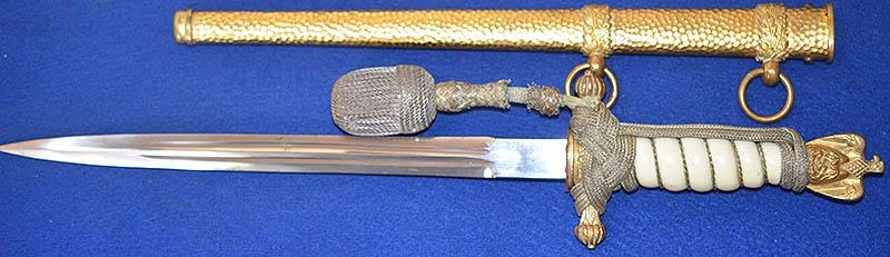 THIRD REICH NAVAL DAGGER WITH HAMMERED SCABBARD AND PLAIN BLADE, COMPLETE WITH GOLD KNOT.