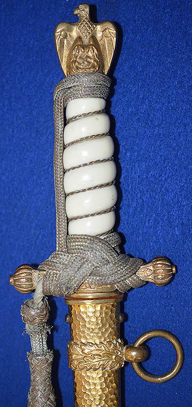 THIRD REICH NAVAL DAGGER WITH HAMMERED SCABBARD AND PLAIN BLADE, COMPLETE WITH GOLD KNOT.