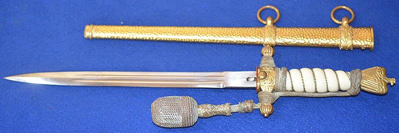 THIRD REICH NAVAL DAGGER WITH HAMMERED SCABBARD AND PLAIN BLADE, COMPLETE WITH GOLD KNOT.