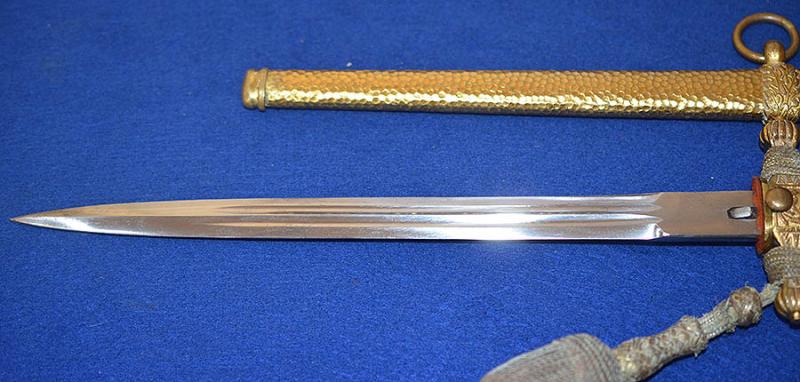 THIRD REICH NAVAL DAGGER WITH HAMMERED SCABBARD AND PLAIN BLADE, COMPLETE WITH GOLD KNOT.